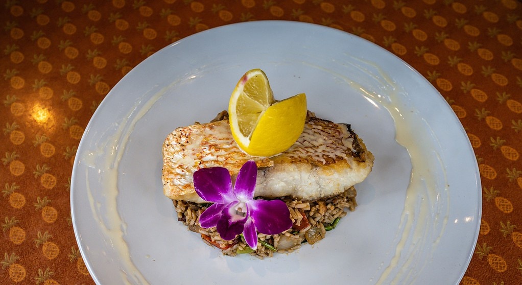 Mahi  mahi  with floral  garnish at Pisces Rising in Mount Dora.