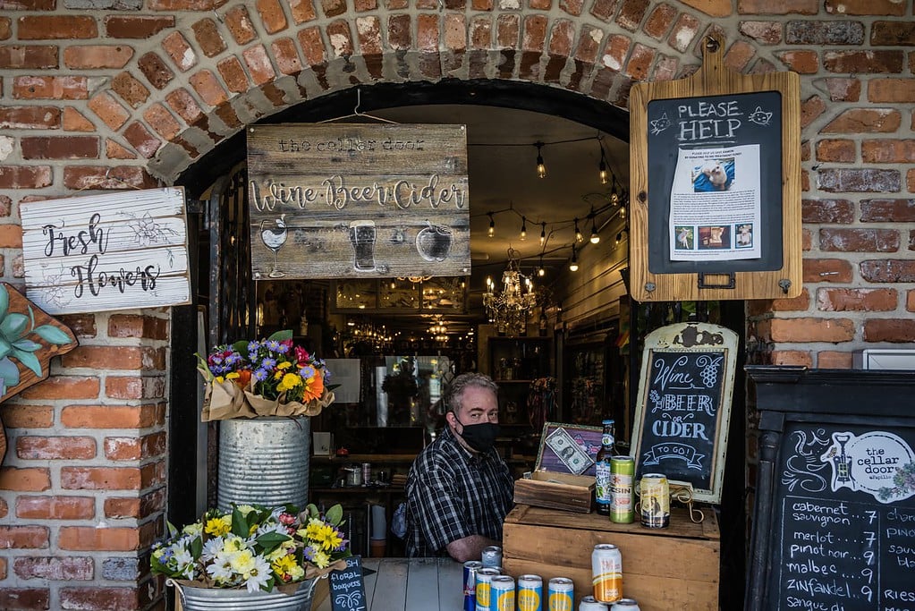 Shop owner at window of The Cellar