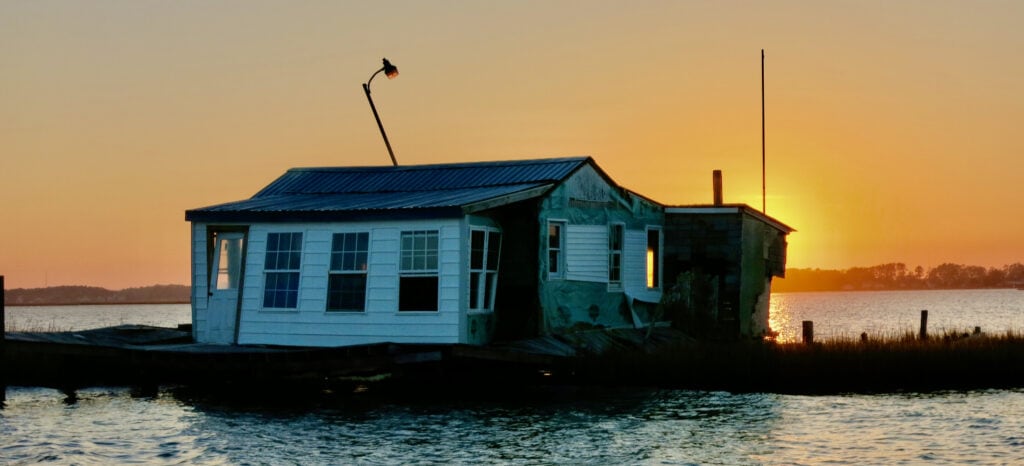 Distressed floating house on the bay in Chincoteague VA summer 2013
