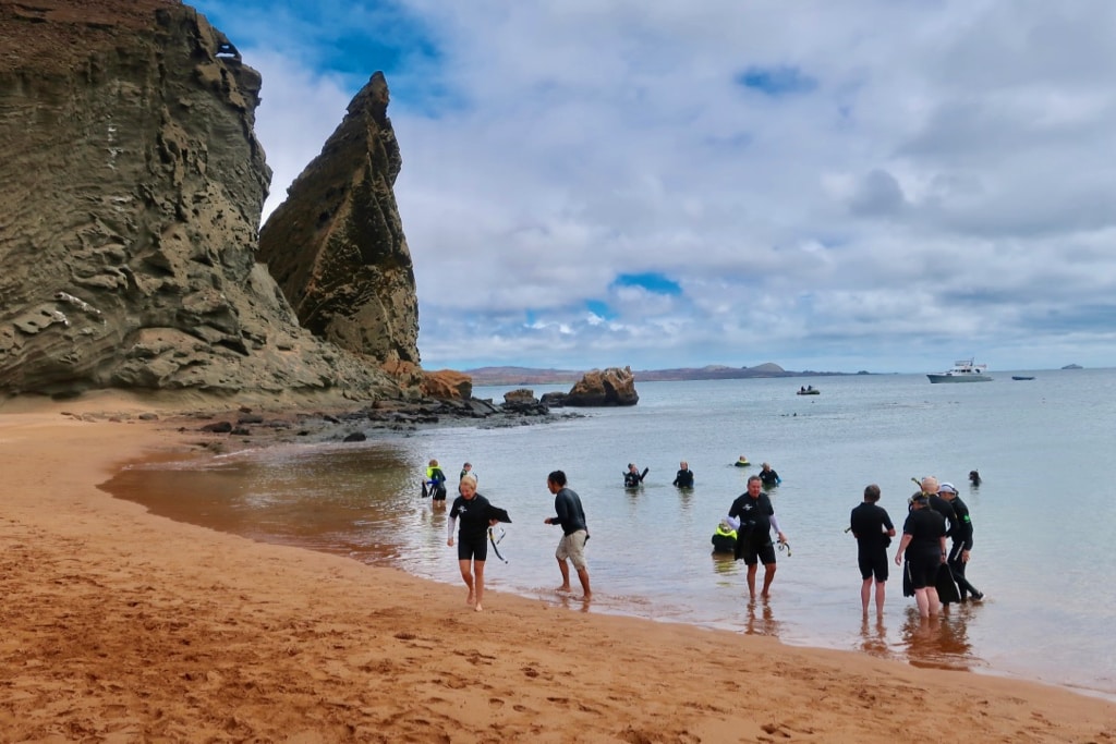 Snorkelers in Buccaneer Cove on Santiago Island Galapagos