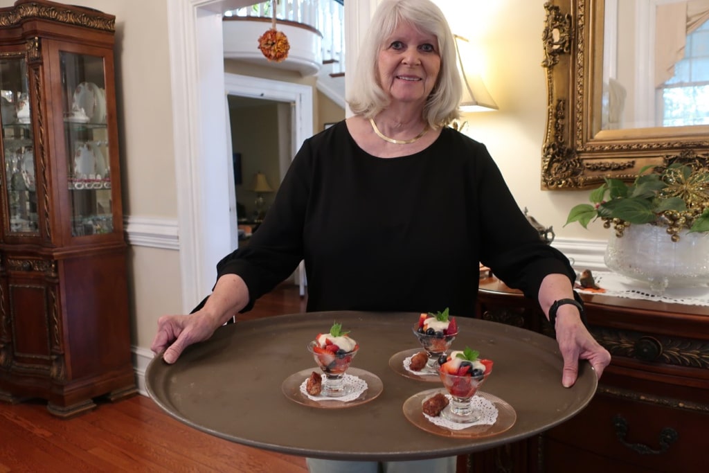 Patti Pizinger with breakfast first course at Trinkle Mansion BnB VA