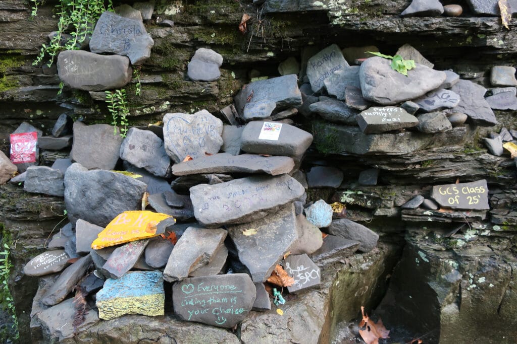 College students make their marks on rock in Ithaca's gorges and below waterfalls.