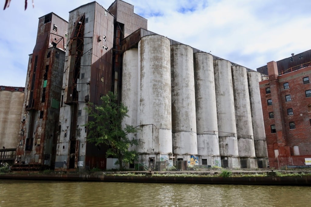 Empty grain silos line the shore of the Buffalo River NY