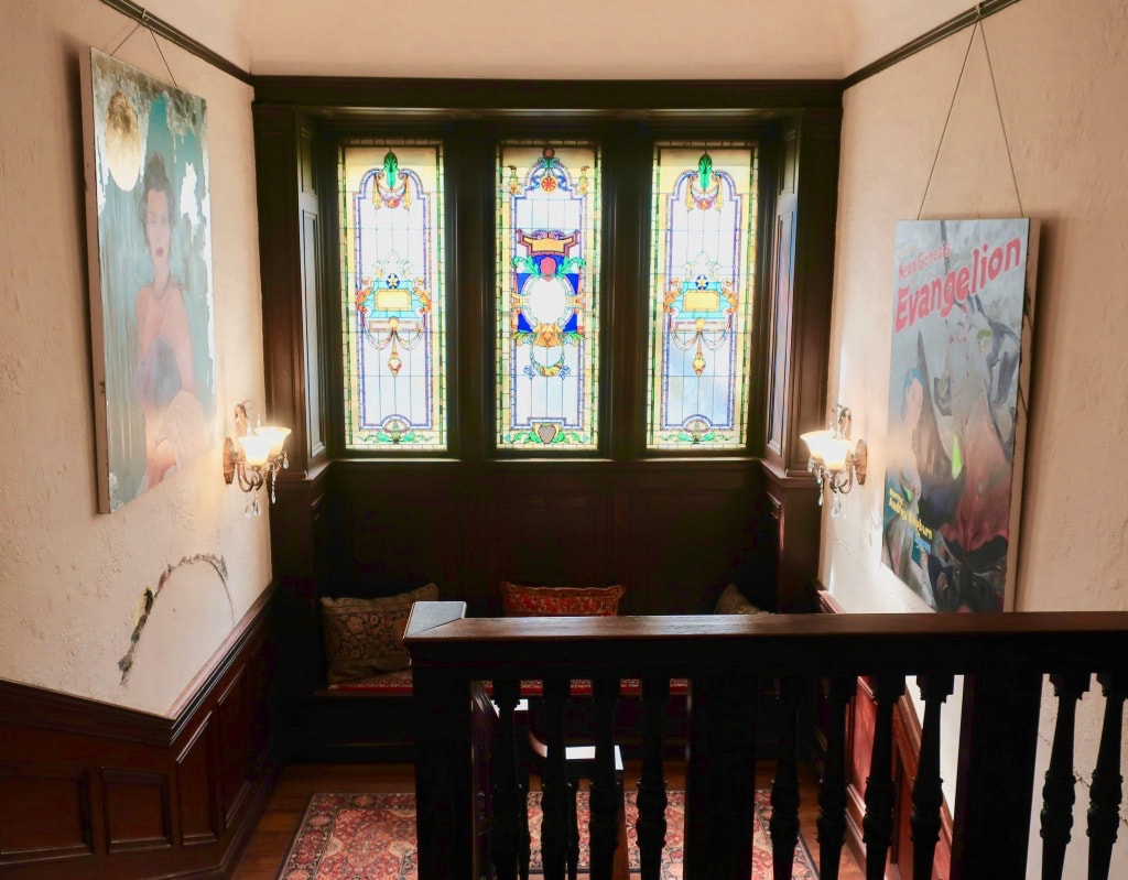 Stained glass windows on stair landing at Inn Buffalo