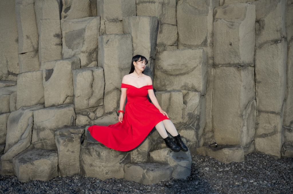 Girl poses on Black Sand Beach