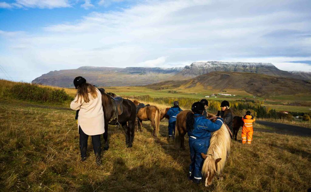 Icelandic horses and riders taking a break.