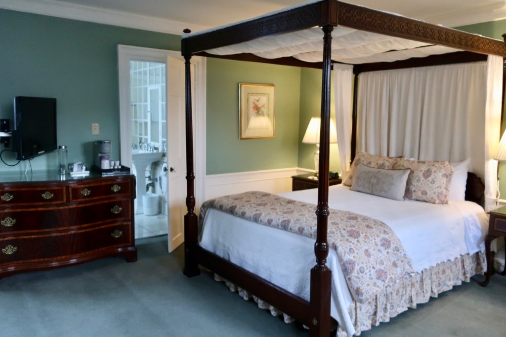 Guest room at Harbor Light Inn Marblehead MA with canopy bed.
