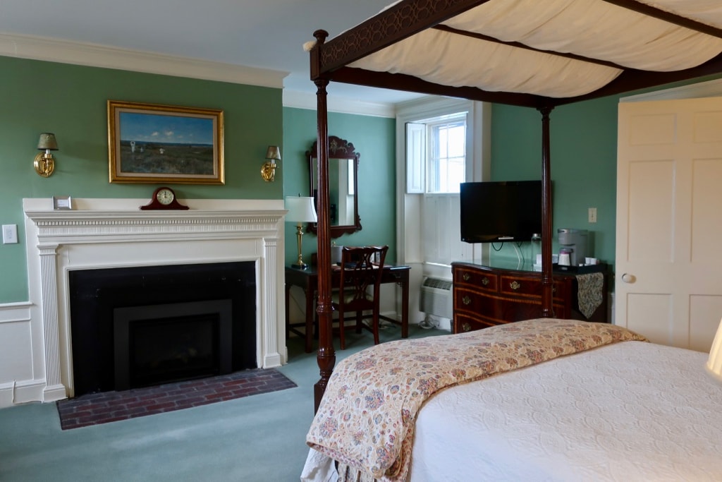 Guest room at Harbor Light Inn with fireplace.