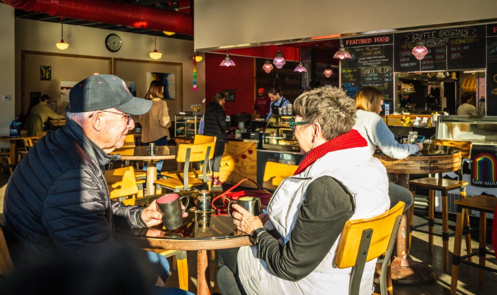 Couple enjoys a cup of coffee at ACOCA Coffee and Cafe