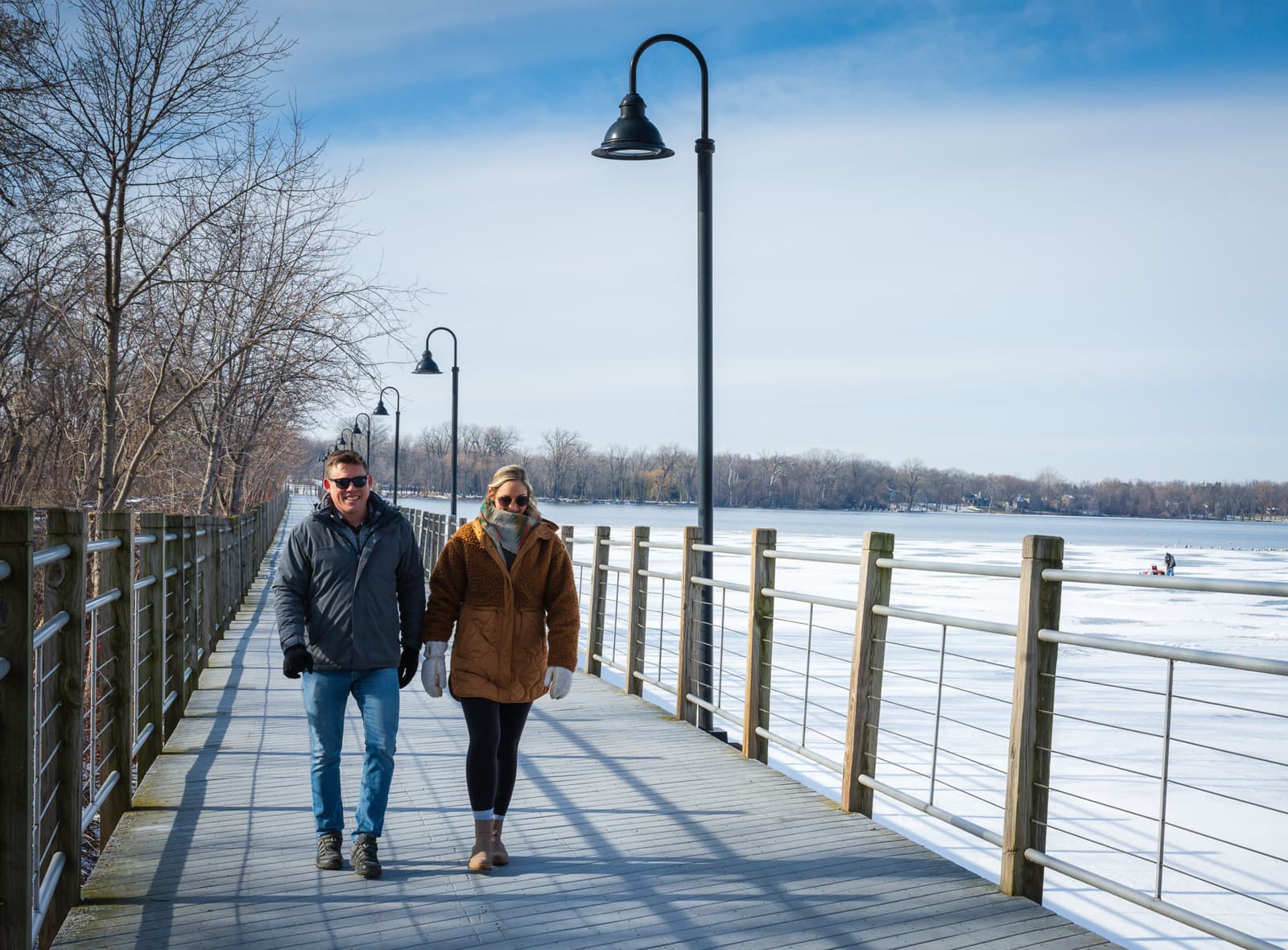 Couples strolls along the Loop the Lake trail. This is one of the things to do in Appleton WI.