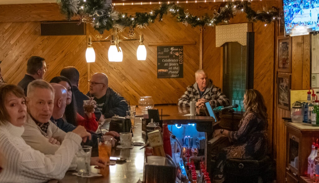 A 125-year-old 9-foot Steinway Grand Piano completes the bar at George's Steak House.