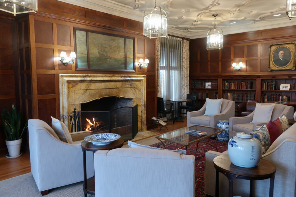 Library at Ocean Edge Resort with fireplace aglow.