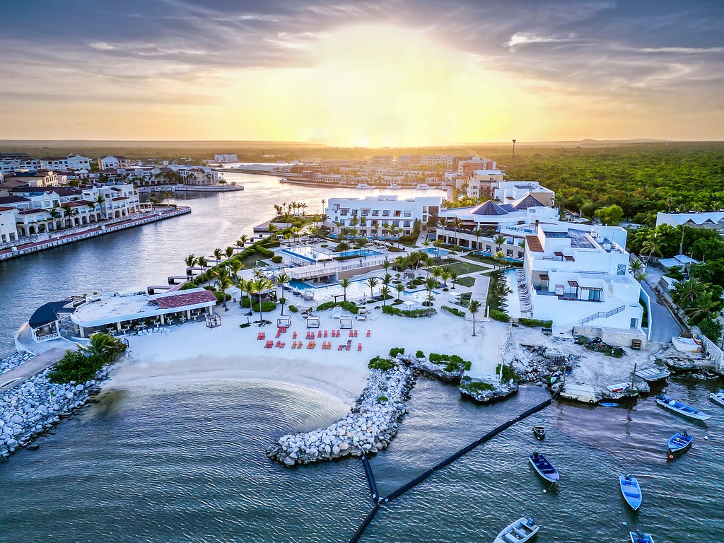 Aerial view of TRS Cap Cana Waterfront & Marina Hotel at sunset.
