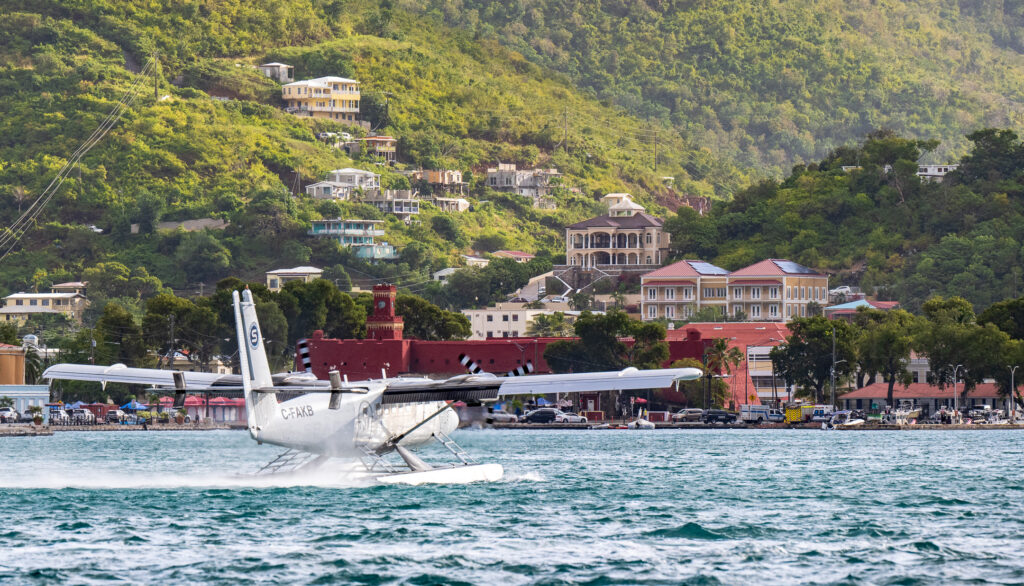 Seabourne Airlines seaplane landing in Charlotte Amalie harbor.