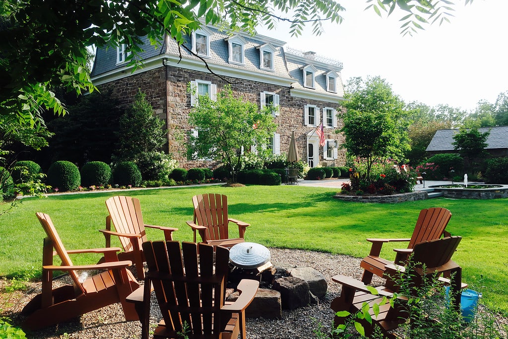 Fire pit and property view of Woolverton Inn NJ