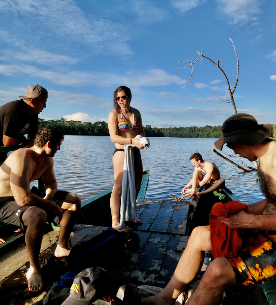 Boating and swimming on Sandoval Lake Peru