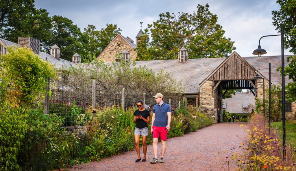 Couple strolling garden paths at Blue Hill at Stone Barns 