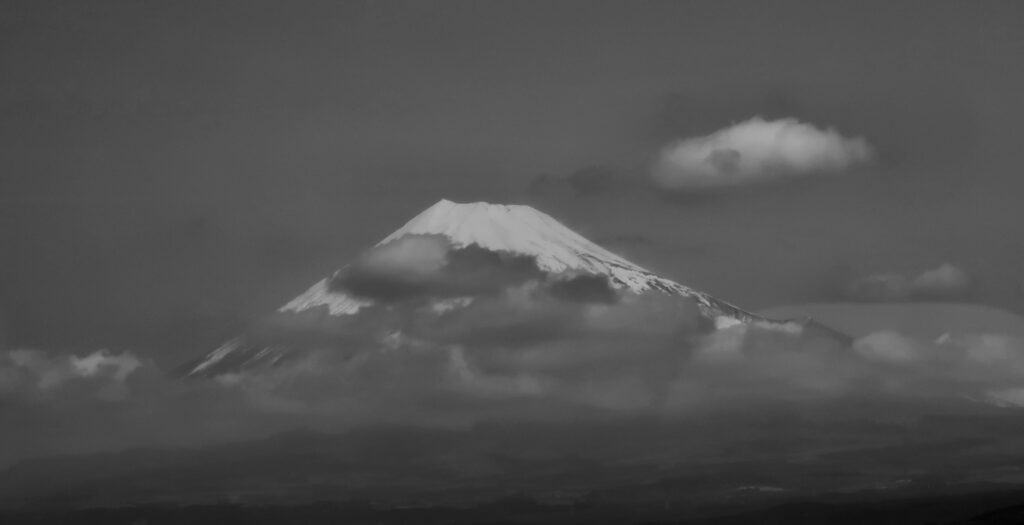 Moody black and white picture of Mt Fuji in stormy weather