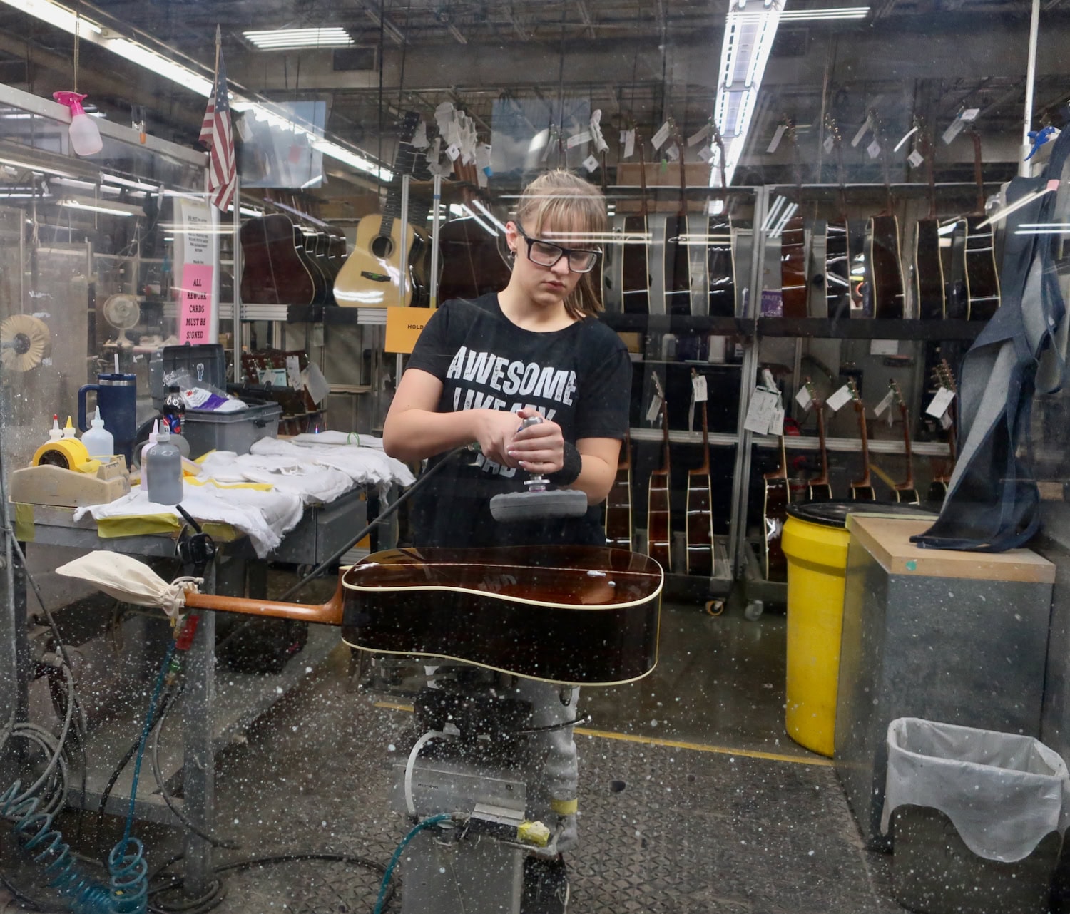 CF Martin Guitar craftswoman polishing guitar, Nazareth PA