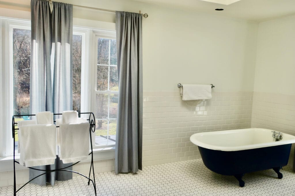 Sunlit bathrooom of Turley Suite Inn at Gristmill Square Warm Springs VA