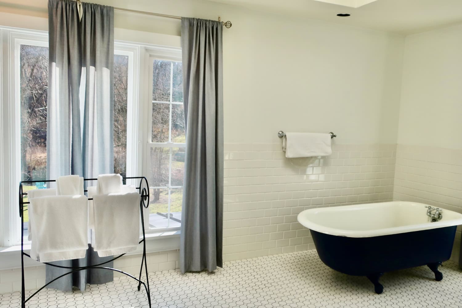 Sunlit bathrooom of Turley Suite Inn at Gristmill Square Warm Springs VA
