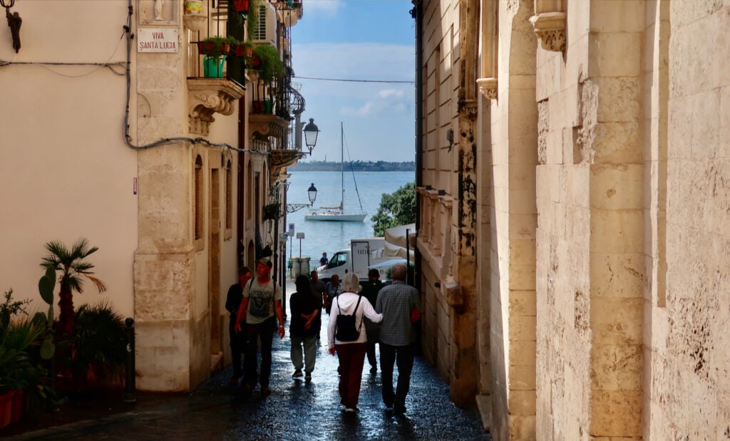 Stone street to harbor on island of Ortigia/Syracuse Sicily
