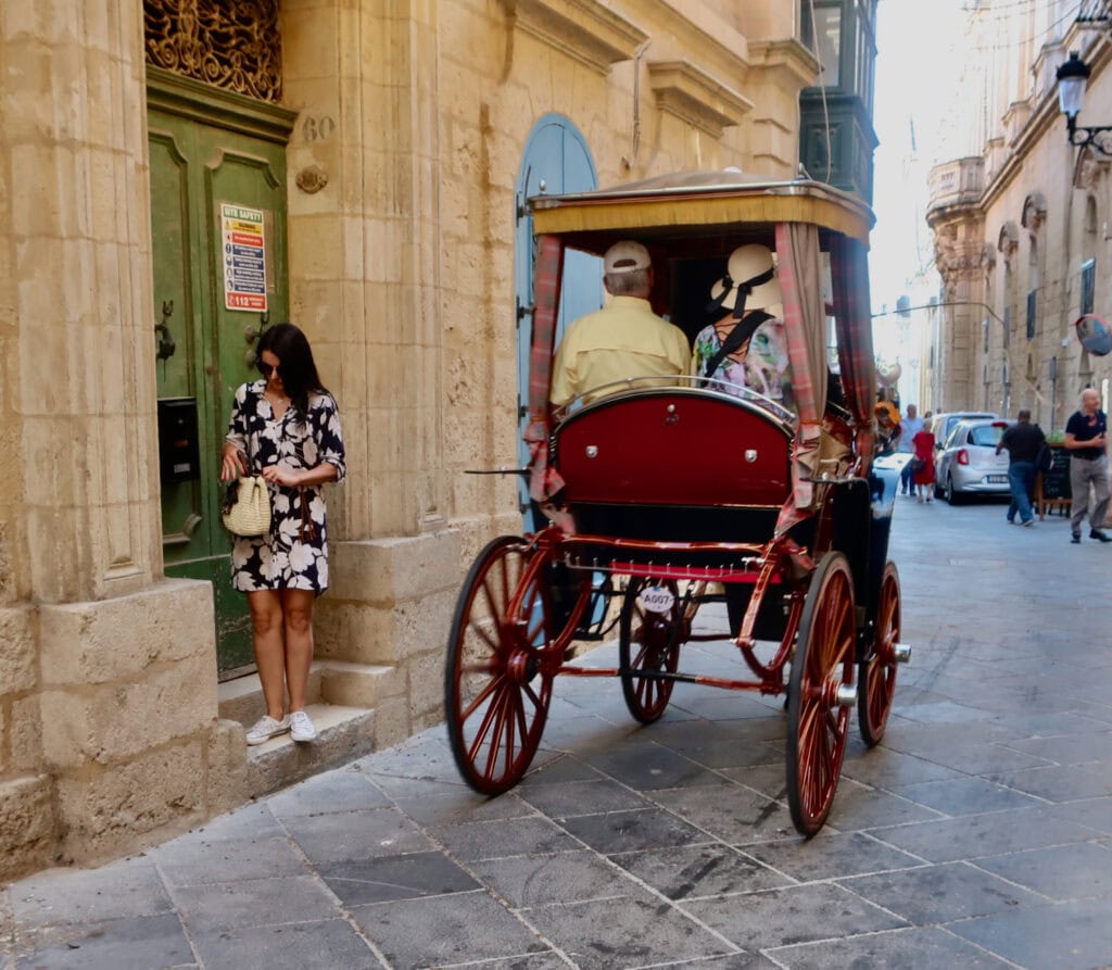 Romantic Malta horse and carriage through stone streets