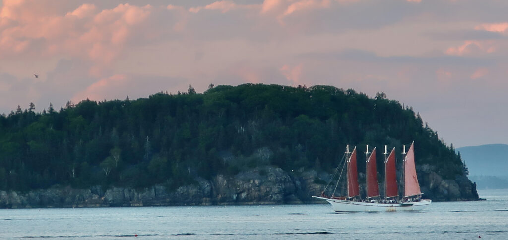 Margaret Todd Windjammer cruise and Bar Harbor Islands at dusk Maine